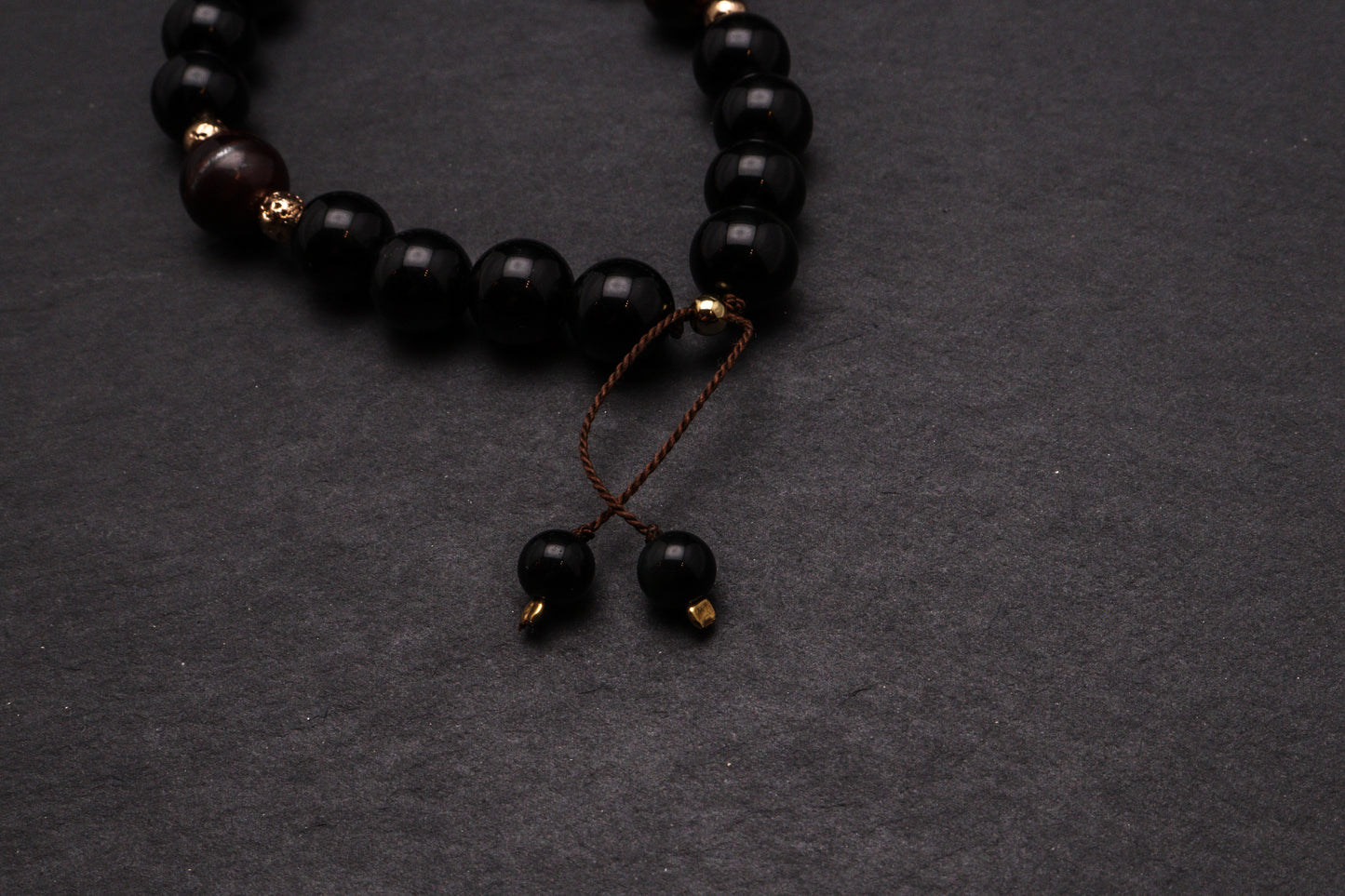 ONYKS Z BAWOLIM OKIEM I LAWĄ - BRANSOLETKA MĘSKA